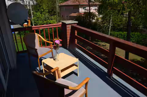 a decent furnished two-room apartment with balcony, washing machine, free parking close to the airport